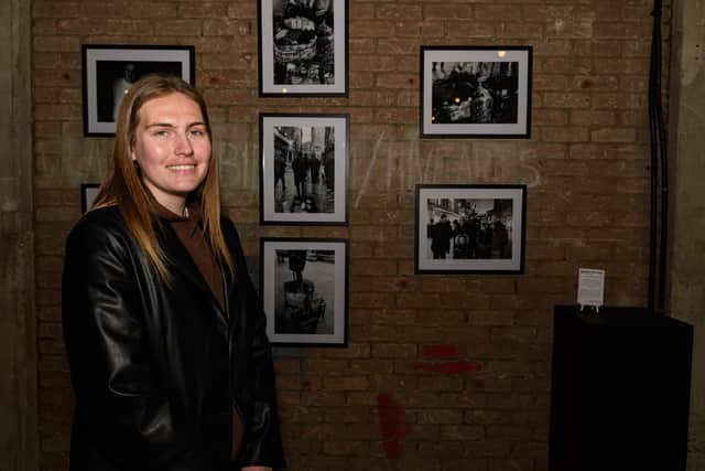 Chloe Bradbury in front of some of her work at the HIVE exhibition. Photo: Kelvin Stuttard