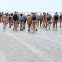 The naturists began the walk fully clothed at Arnside and disrobed about a mile from shore.
