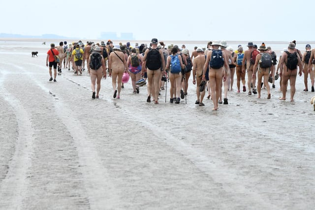 The naturists began the walk fully clothed at Arnside and disrobed about a mile from shore.