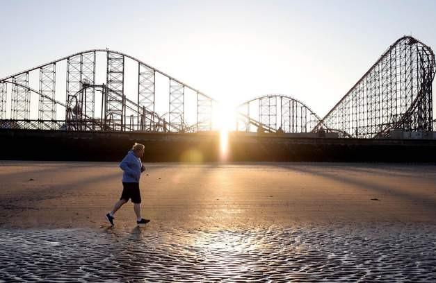 Boris Johnson runs on Blackpool Beach during his time in the resort for the Conservative Party conference earlier this year. Photograph credit: Conservative Party/ @Conservatives