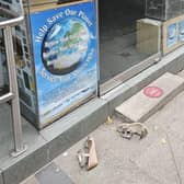 The broken shoes left outside The Market Cobbler overnight on Friday.