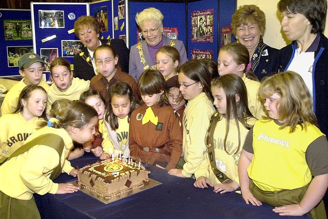 Brownies at St. Thomas' Church, St. Annes celebrated their 75th anniversary. Seven-year-old Hannah McNeil (left), blows out the candles on their birthday cake, watched by fellow members of the 4th St. Annes (St. Thomas') Brownies, after their thanksgiving service. Also pictured, are back (from left), the Mayoress of Fylde Mrs Maxine Chew, the Mayor of Fylde Councillor Hannah Cummings-Miller, Elaine Robinson (president Girl Guiding Lancashire West) and Sue Allen (4th St Annes Brown Owl and Fylde south divisional commissioner