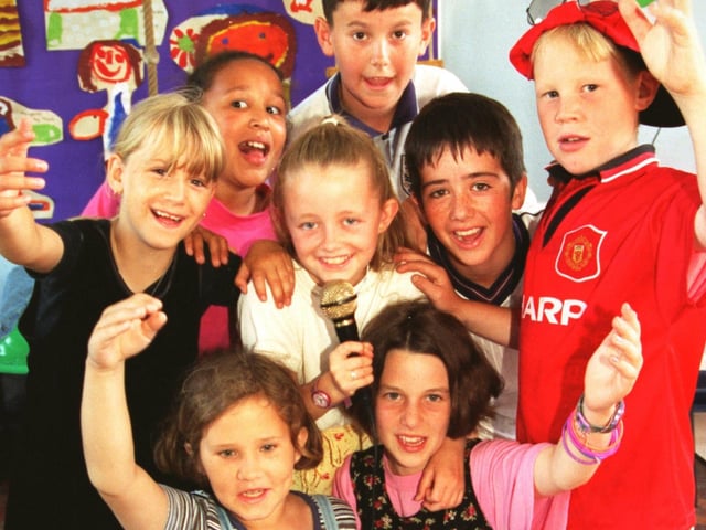 Children at the play scheme at Lancaster Road School, Morecambe, Michaela Montford, Danielle Pye, Naomi Jiagbogu, Stephanie Austin, Nicola Hanley, Thomas Horton, Neil Ennis and Lawrence Barnard, sing some of their favorite songs at a talent contest.