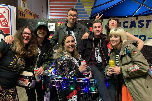 The Lancaster Music Co-op team, including David Blackwell (second left) and Holly Blackwell (front right) is celebrating news that the venue will re-open next year.