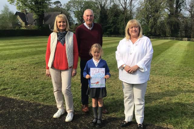 Action group members Mike and Debbie Leece, and Mrs Helen Soutar, with another competition winner.