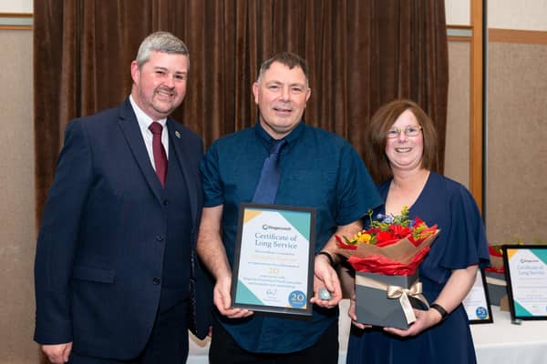 Morecambe bus driver Chris Raymond (centre) receives his long service award from Stagecoach Managing Director Rob Jones (left). Picture: Harry Atkinson
