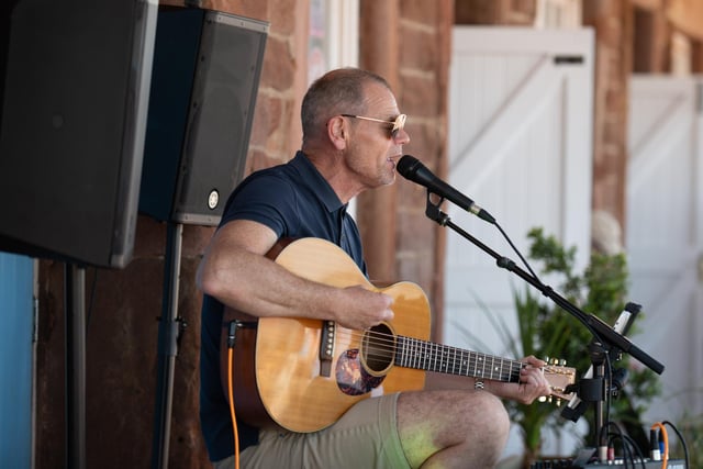 Morecambe Music Festival Acts perform at various venues on the promenade and around the town centre. Pictured - Playing at the Stone Jetty Cafe: Accoustic Singer Dan Doherty. 10.07.2022. Picture by Anthony Farran.