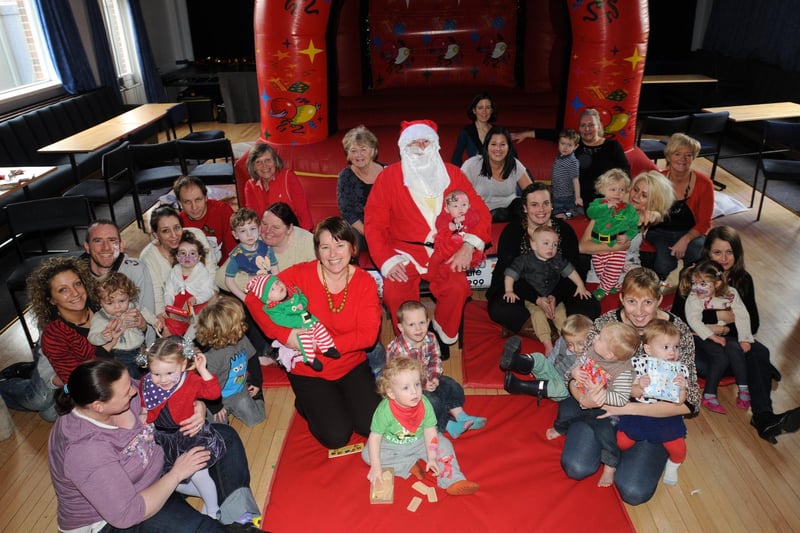 Parents and children enjoy themselves with Father Christmas at the Home Start Christmas party, which was held at Trimpbell Club.