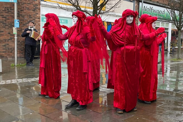Protestors dressed in red in Morecambe at the weekend.
