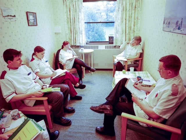 A staff change over meeting on ward 23 at the RLI in 2000. Photo by DJ Clark.