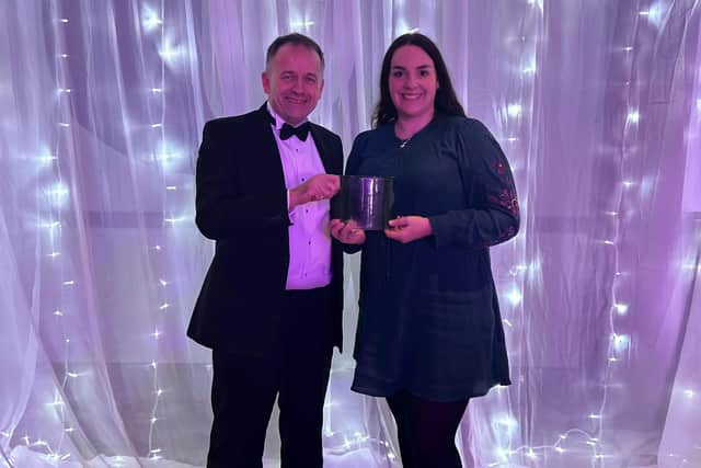Lancaster University’s carbon, environment and sustainability manager Jon Mills and marketing and communications Officer Natalie Bauer holding the Money for Good trophy at the 2023 Green Gown Awards.