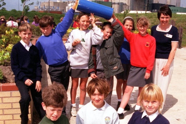 Pupils from Trumacar, St Peter's, St Patrick's, and Overton St Helen's schools with a time capsule which was planted in the new nature park at Heysham power station. Also pictured is Sarah Haddington, the main organiser of the new nature park.