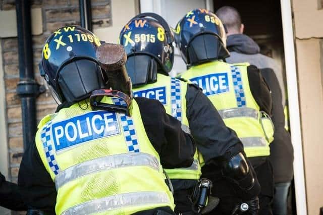 Police seized suspected drugs and snap bags in two raids on properties in Carnforth.