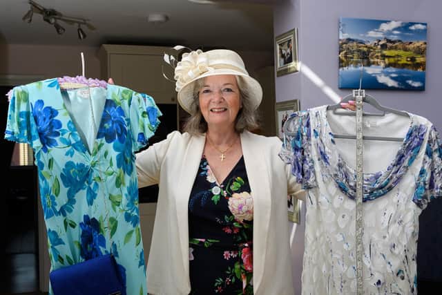Coun Joyce Pritchard with some of her second-hand mayoral outfits.