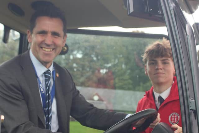 Year 12 student Orion Woodcock with head Dr Chris Pyle at the handover of the new tractor. Photo by Max Lawrence-Scholefield