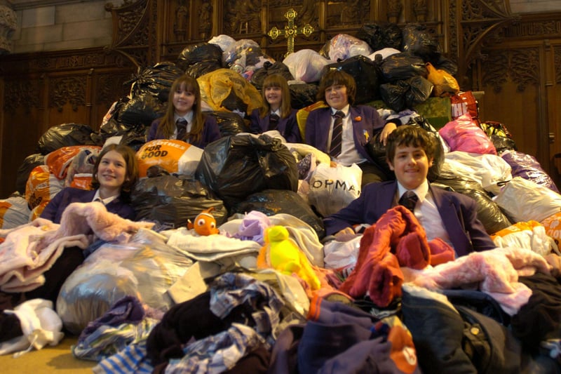 Year 10 pupils at Ripley St Thomas CE Primary School, Beth Procter, Kerry Burge, Lizzie Soole, Rory Baxter and Ally Bell, with a mountain of clothes which was collected for the Funzi Bodo Trust.