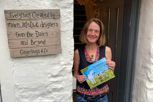 Artist Clare Tyas with her new book at its launch at Gingerbugs and Co in Ingleton. Photo by Stephanie Hughes.