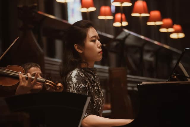Siqian Li at last year's festival. She will attempt to play every acoustic piano in the city centre this year. Picture by Nettlespie Photography