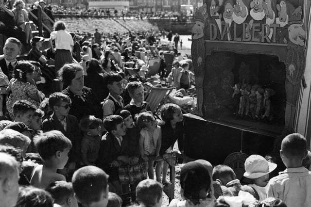 A Punch and Judy show of Snow White and the Seven Dwarfs at Morecambe in August 1939.