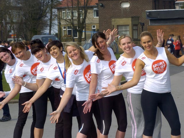 Office staff who took part in a mass egg and spoon race, piggy back and three legged race world record attempt.