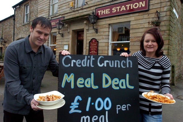 Cheap as chips...Station Hotel licensees Karen Murphy and Darren Gilchrist with some of their £1 meals outside the Caton pub.