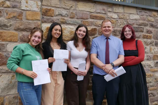 Lancaster Girls' Grammar School pupils Ana Anderco, Esha Biyani and Lucy Byrne with head Chis Beard and and alumnae Erin Byrne who accompanied her sister.