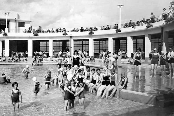 Swimmers of all ages pose for a picture at the old swimming stadium in Morecambe.