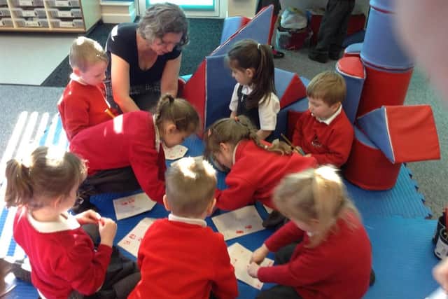 Julie Bowler with youngsters at Trumacar Nursery and Community Primary School.