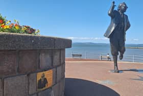 The new plaque in position to the side of the statue, depicting Mike continuing to be Eric's 'right hand man'.