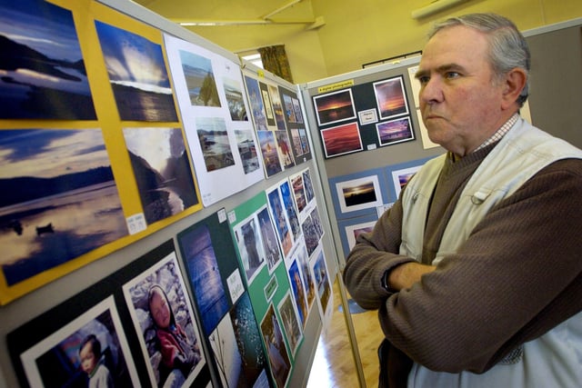 Austwick 23rd annual village show in the parish hall in 2011. Wildlife photographer Colin Preston judges the photographic entries.