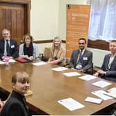 Lisa Ashmore (third left) at the All-Party Parliamentary Group on Radiotherapy, chaired by Tim Farron MP (at head of table).