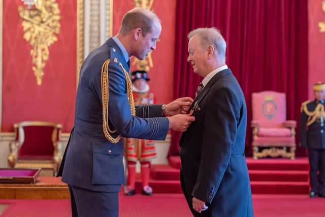 Peter Duffy receiving his MBE from Prince William last year.