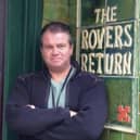Graham Burton outside the famous Rovers Return on the Coronation Street set.