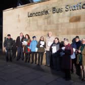 Lancaster Bus Users' Group giving out leaflets at the bus station.