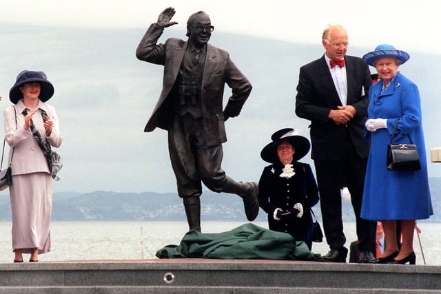 The Queen visits Morecambe to unveil a statue to Eric Morecambe, Charles Wilson From Lancaster City Council with The Queen , far left Joan Eric Morecambe's widow looks on Pic By Dave Nelson.