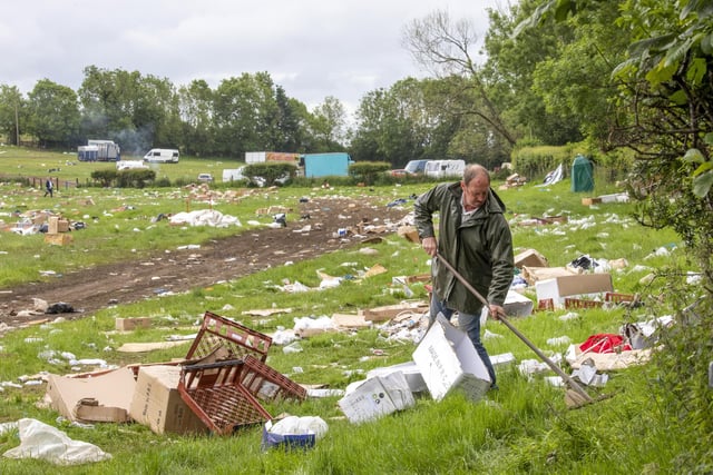 Local residents begin to clear up rubbish left by travellers after the weekends Appleby Horse Fair in Appleby-in-Westmorland, Cumbria. June 13 2022