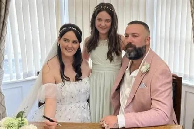 Graham Layton, his wife Hayley and their daughter Sophie on their wedding day four months before the accident.