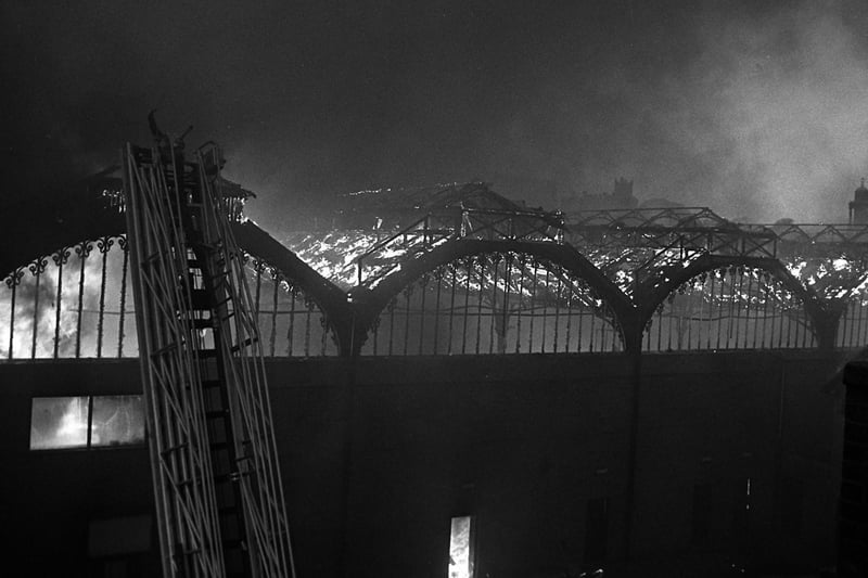 Flames envelop the market roof during the 1984 blaze.