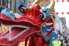A colourful dragon makes its way through Lancaster city centre.