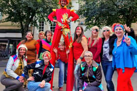 Festival goers pose for a photo with one of the performers.