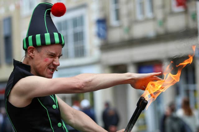 A performer gets ready to eat fire at Lancaster Festa Italia.