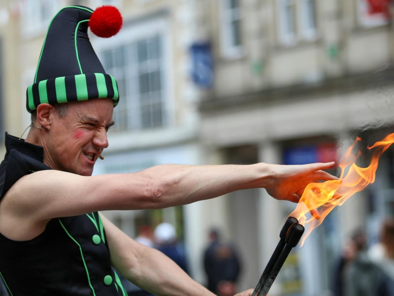 A performer gets ready to eat fire at Lancaster Festa Italia.