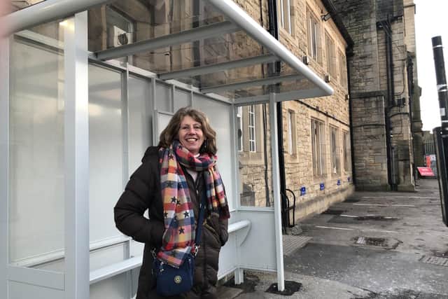 County Coun Gina Dowding at the new bus shelter outside Lancaster railway station.