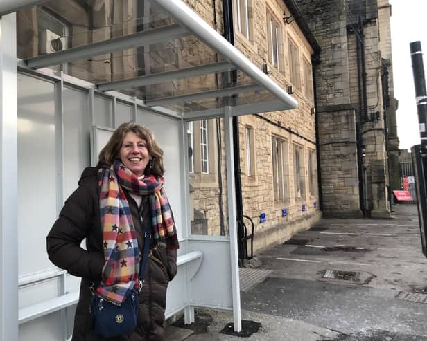 County Coun Gina Dowding at the new bus shelter outside Lancaster railway station.