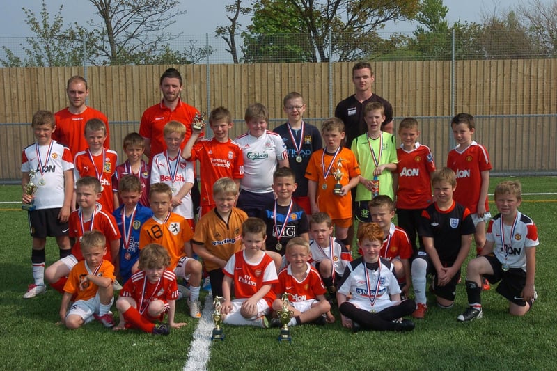 Young footballers who attended a Morecambe FC Easter soccer school at the Globe Arena and received trophies, medals and Easter eggs.