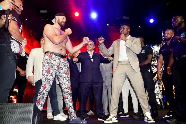 Tyson Fury (left) and Francis Ngannou (right) during a press conference (Credit: PA/ James Manning)