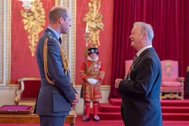 Peter Duffy chats with Prince William as he receives his MBE.