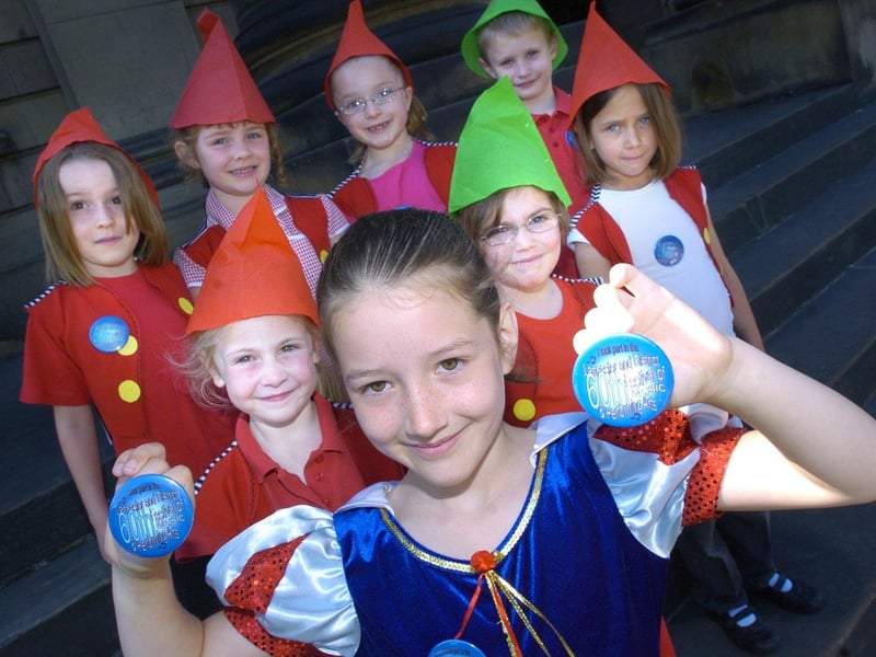 Pupils from Lancaster Road School proudly show off 60th anniversary badges at a Schools Music Festival rehearsal at The Ashton Hall, Lancaster.