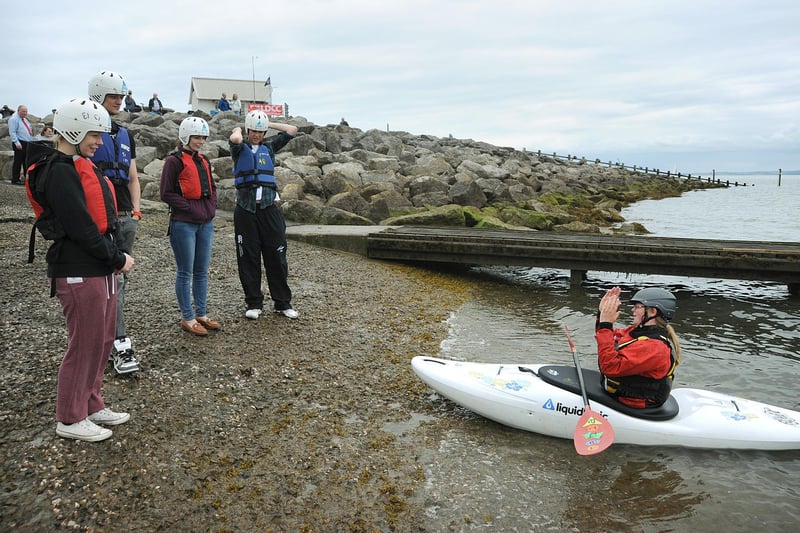 Lancaster and District Canoeing Club organised the Morecambe Bay Waterfest in Morecambe, with a variety of events taking place along the seafront. Here, club member Holly Wilson explains the rudiments of the sport to a group about to sit in a canoe for the first time.