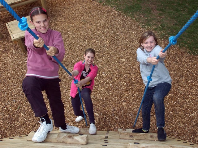 Pupils from Morecambe High School, Niamh Whiteside, Hayley Stubbs and Paige Clark, try out the new Natural Adventure Play Area in Happy Mount Park.